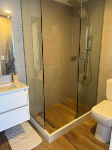 a bathroom with a shower and a toilet at Moderno in Punta del Este