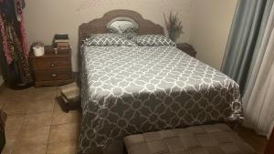 a bedroom with a large bed and a dresser at Casa Caribe in San Felipe +4 photos