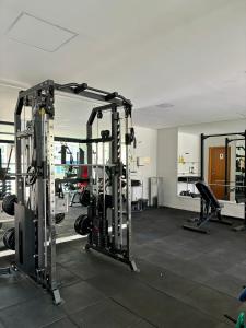 a gym with several tread machines in a room at Cantinho do Aconchego DF in Brasilia