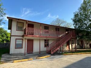 an apartment building with a balcony and a staircase at 1326-#3 downtown comfy & clean 1bedroom unit in San Antonio