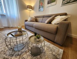 a living room with a couch and two tables at CLASSY HOMES - A due passi dal mare in Sanremo
