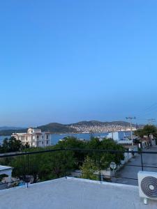 a view of a city with a view of the water at Marina's house in Salamina