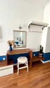 a dressing room with a mirror and a stool at Marcel Zadar Old Town in Zadar