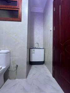 a bathroom with a toilet and a sink at شقق جدة دستنيشن in Jeddah