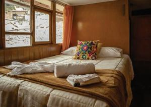 Voodi või voodid majutusasutuse WARM AND CENTRAL HOUSE WITH SPECTACULAR VIEW OF CUSCO toas
