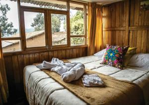 Voodi või voodid majutusasutuse WARM AND CENTRAL HOUSE WITH SPECTACULAR VIEW OF CUSCO toas