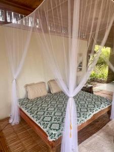 A bed or beds in a room at Casa Maiara (Eco friendly)