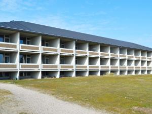 a large white building with a black roof at Holiday home Fanø VII in Fanø