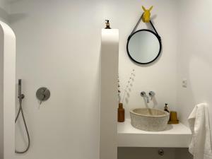 a bathroom with a sink and a mirror on the wall at Casa da Maria in Évora +34 photos