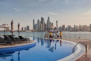 a swimming pool with a view of the city at Oceana Atlantic Seaside Apt in Dubai
