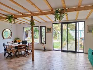 a large living room with a table and chairs at Vila lac lll in Năvodari
