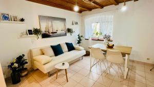 a living room with a couch and a table at Olivier house in Zaglav