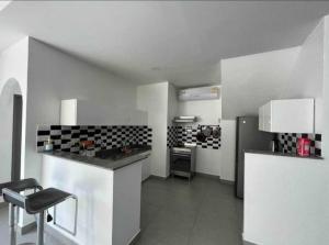 a kitchen with a counter and a stove in it at south pattaya,5BR modern villa in Pattaya Central