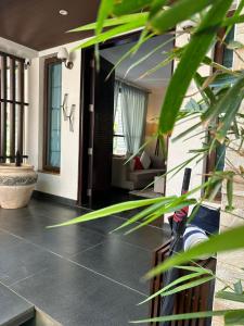 a lobby of a house with a living room at Frangipani Villa in Anjuna