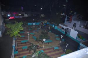 an aerial view of a courtyard at night at Hotel Solis Stay in Solapur