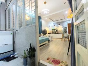 a view of a living room and kitchen from a room at Eco SaiGon Apartments in Ho Chi Minh City