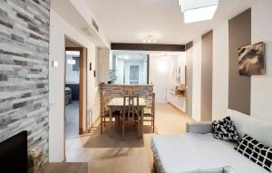 a living room with a table and a couch at Gorgeous Apartment In Rota With Wifi in Rota