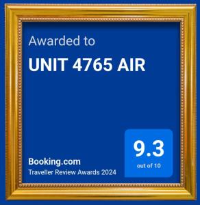 a picture frame with the text upgraded to unit air at UNIT 4765 AIR in Manila