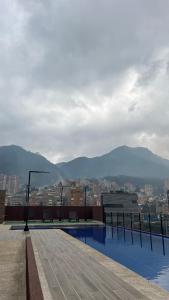 a rooftop of a building with a view of a city at Hermoso Apartamento Loft en Bogota Chapinero in Bogotá