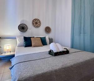 a bedroom with a large bed in a room at Casa by Hokkum Studios in Kokkari