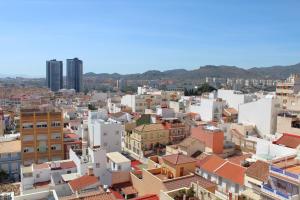 uitzicht op een stad met gebouwen bij Rare find! Skyline view-Modern 6 bed 2 bath flat in the heart of Málaga in Málaga