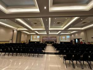 a large room with chairs and a stage in it at GRAND MULYA HOTEL BOGOR in Sukaraja