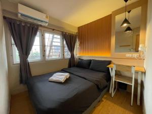 Postel nebo postele na pokoji v ubytování Mind Day Hostel Khaosan