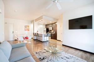 a living room with a couch and a table at 2BR Modern Luxury Condo WeHo in Los Angeles