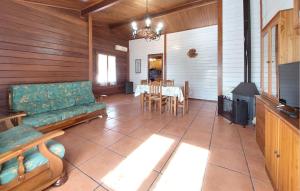 a living room with a couch and a table at Lovely Home In Turís With Swimming Pool in Turís