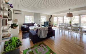 a living room with a couch and a table at 3 Bedroom Stunning Home In Hrby in Hörby