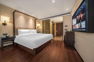 Postel nebo postele na pokoji v ubytování SSAW Hotel (Jiefangbei Hongyadong Branch)