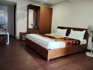 Postel nebo postele na pokoji v ubytování HAZRATH INN + 8 fotografií