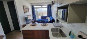 a kitchen with a sink and a counter top at Apartamento Parada 50 in Guatemala