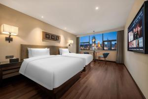 Postel nebo postele na pokoji v ubytování SSAW Hotel (Jiefangbei Hongyadong Branch)