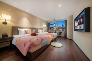 Postel nebo postele na pokoji v ubytování SSAW Hotel (Jiefangbei Hongyadong Branch)