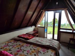 Ένα ή περισσότερα κρεβάτια σε δωμάτιο στο Bugo Camp, Glamping & Natural Activity