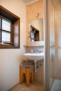 a bathroom with a sink and a mirror at Naturidyll Kollnbergmühle in Fürstenstein