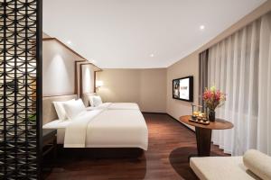 Postel nebo postele na pokoji v ubytování SSAW Hotel (Jiefangbei Hongyadong Branch)