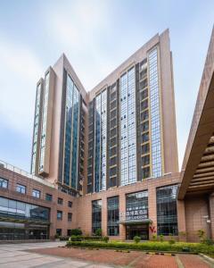 a large building with many windows at Veegle By Landison Ningbo in Ningbo