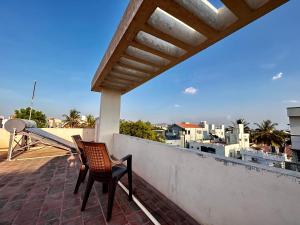 A balcony or terrace at Roy Enclave by Rohi stays