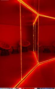 a room with red lights on a wall with tables at Готель Колиба Колорит in Tatariv