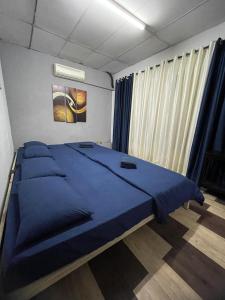 מיטה או מיטות בחדר ב-Art Motel Kulim