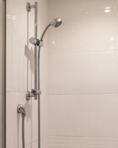 a shower with a glass door in a bathroom at TQ luxurious 2 bed flat in Birmingham