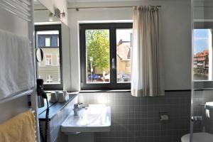 Koupelna v ubytování Tandem Hotel