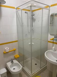 a bathroom with a glass shower and a sink at Aurora e Andrea San Vito lo Capo in San Vito lo Capo