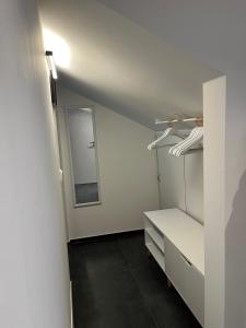 a room with a white closet with a mirror at Lieblingsplatz-Bodensee in Markdorf