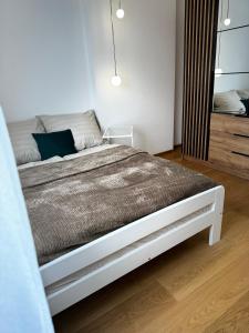 Cama ou camas em um quarto em Apartament na Orkana