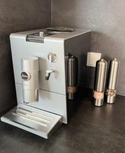 a small white coffee machine sitting on a counter at Lieblingsplatz-Bodensee in Markdorf