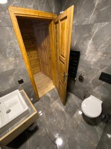 a bathroom with a toilet and a sink at Moi in Rize