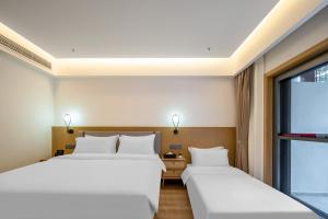 Hunan New Pipaxi Hotel客房内的一张或多张床位